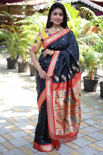 Black paithani silk blend saree with contrast red zari border