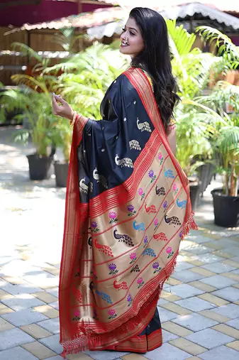 Black paithani silk blend saree with contrast red zari border