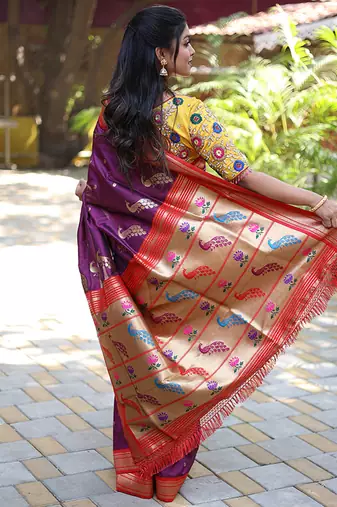 Purple paithani silk blend saree with contrast red zari border