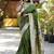 Dark green paithani silk blend saree with floral & peacock motifs