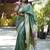 Green paithani silk blend saree with floral & peacock motifs