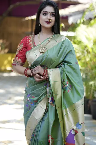 Green paithani silk blend saree with floral & peacock motifs