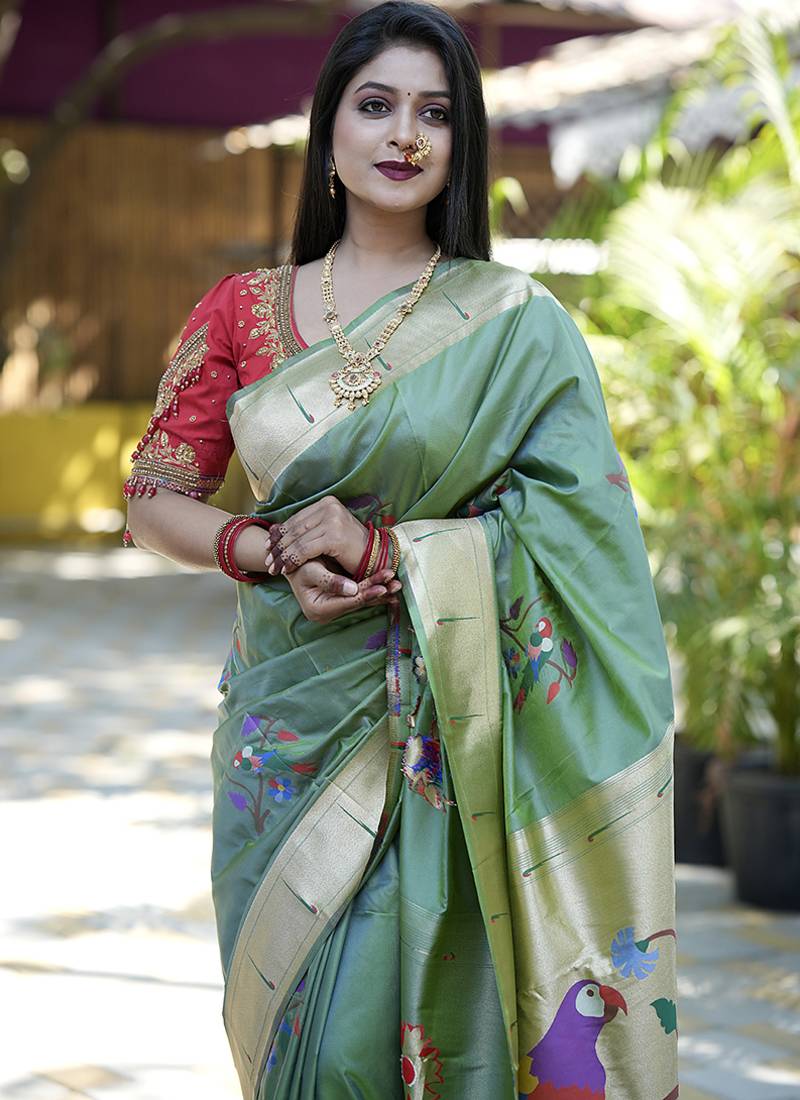 Green paithani silk blend saree with floral & peacock motifs