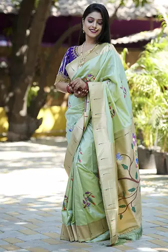 Mint green paithani silk blend saree with floral & peacock motifs