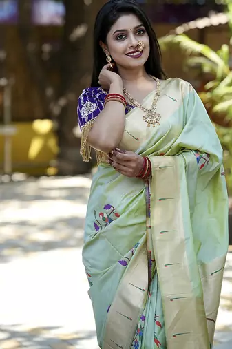 Mint green paithani silk blend saree with floral & peacock motifs