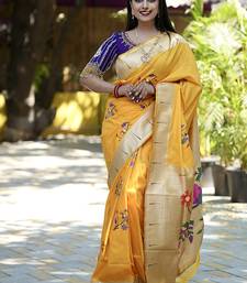 Mustard paithani silk blend saree with floral & peacock motifs