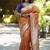 Orange paithani silk blend saree with floral & peacock motifs