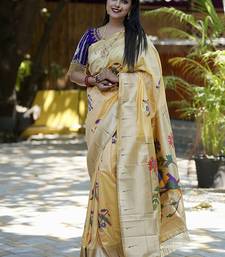 Cream paithani silk blend saree with floral & peacock motifs