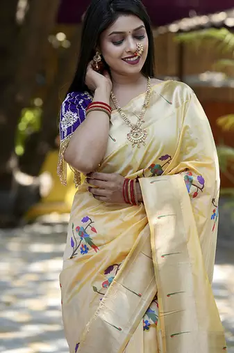 Cream paithani silk blend saree with floral & peacock motifs