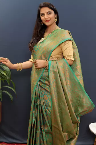 sea green & gold woven banarasi silk blend saree with rich zari border