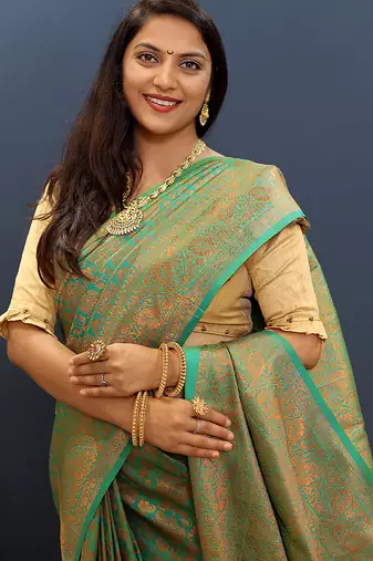 sea green & gold woven banarasi silk blend saree with rich zari border