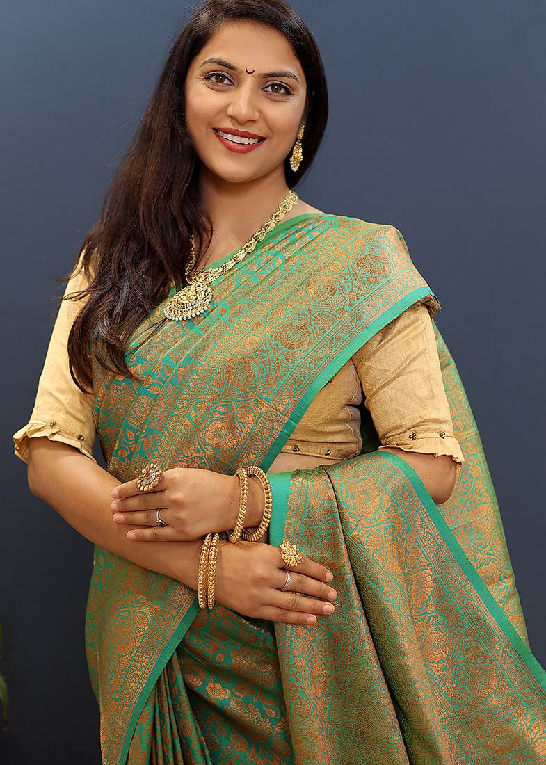 sea green & gold woven banarasi silk blend saree with rich zari border