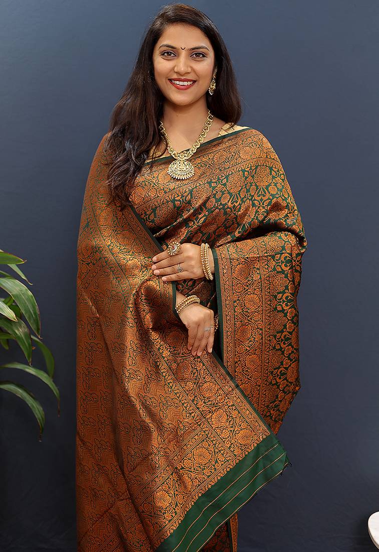 dark green & gold woven banarasi silk blend saree with rich zari border
