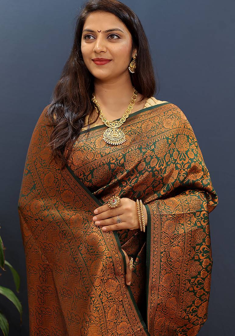 dark green & gold woven banarasi silk blend saree with rich zari border