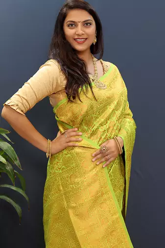 lemon green & gold woven banarasi silk blend saree with rich zari border