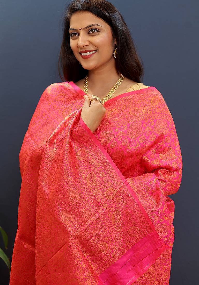 rani pink & gold woven banarasi silk blend saree with rich zari border