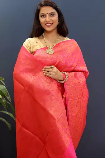 rani pink & gold woven banarasi silk blend saree with rich zari border