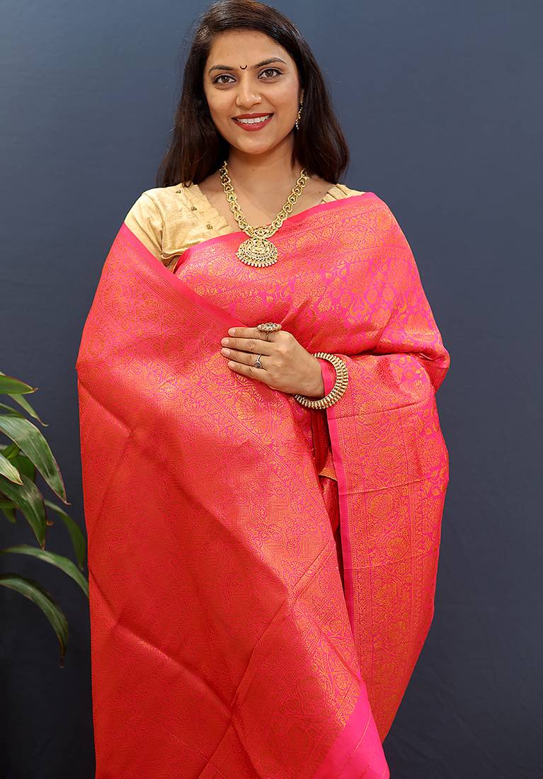 rani pink & gold woven banarasi silk blend saree with rich zari border