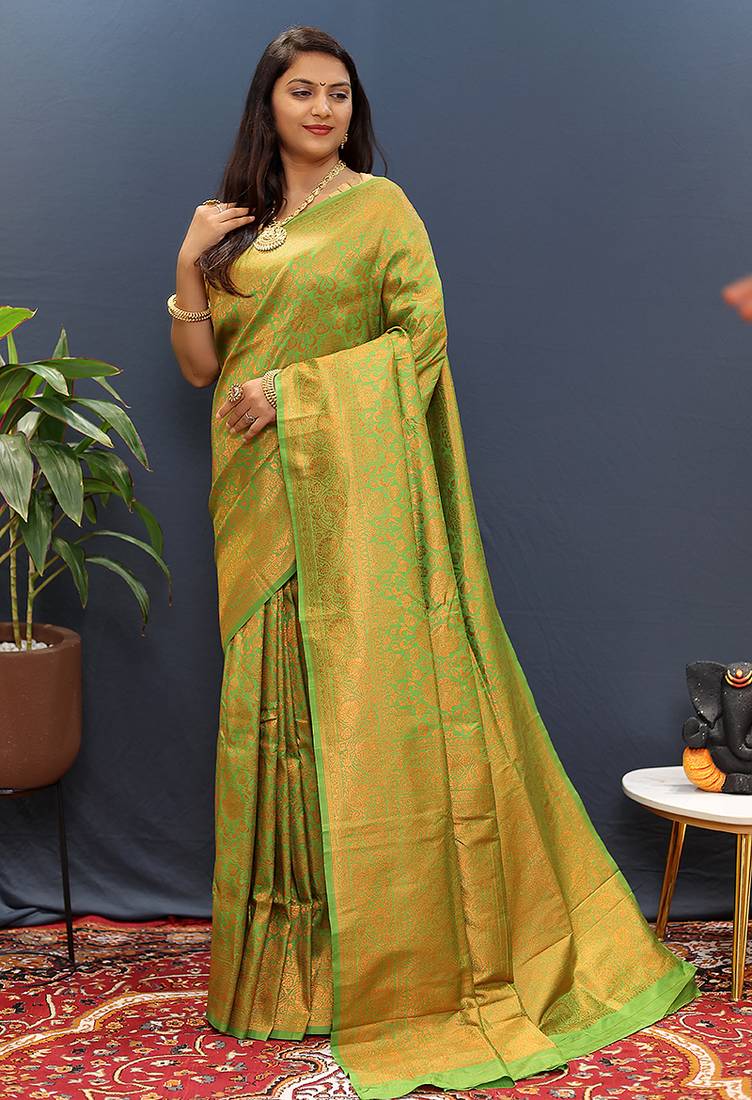 green & gold woven banarasi silk blend saree with rich zari border