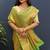 green & gold woven banarasi silk blend saree with rich zari border