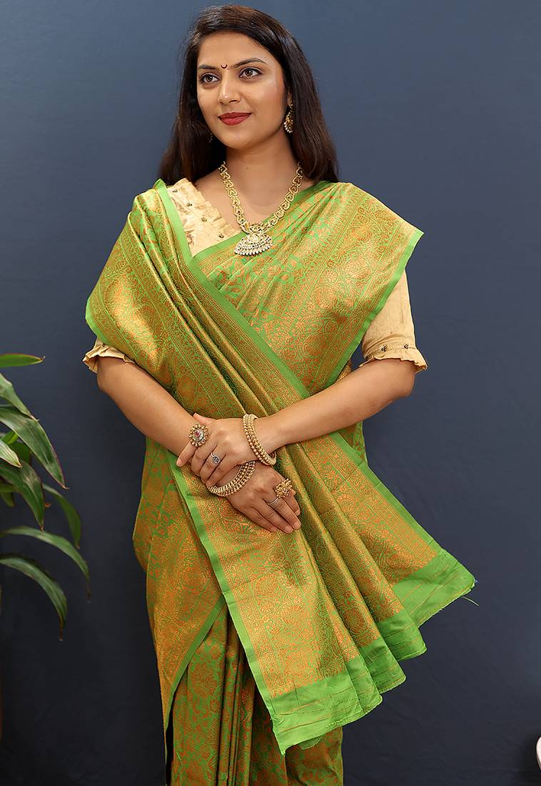 green & gold woven banarasi silk blend saree with rich zari border