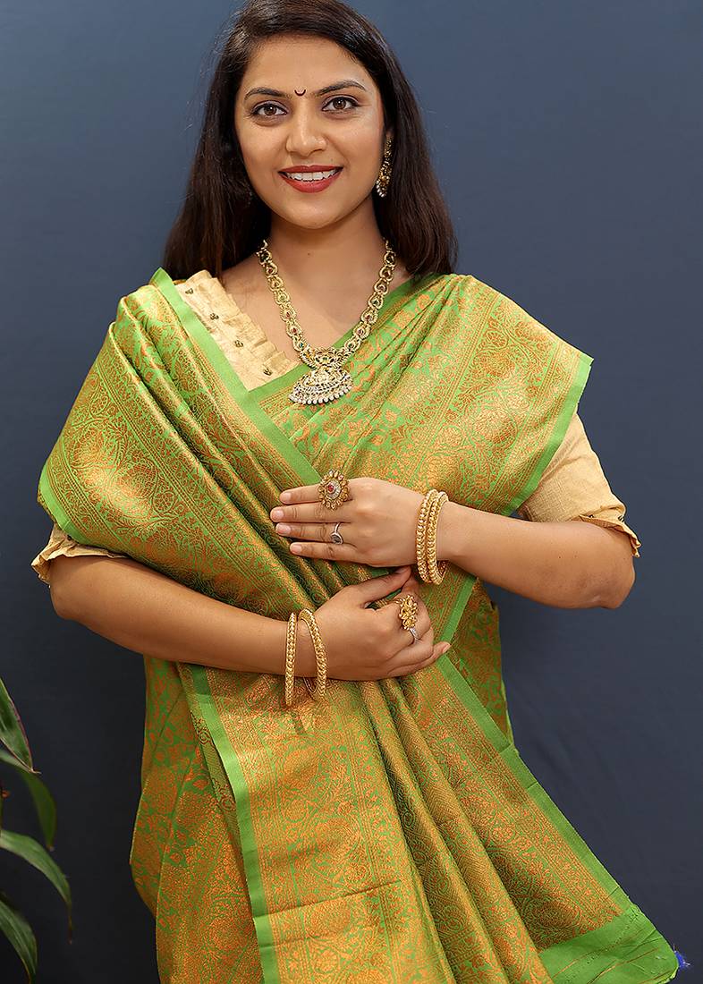 green & gold woven banarasi silk blend saree with rich zari border
