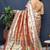 Rose gold silk blend saree with teal floral zari weaving & rich brocade pallu