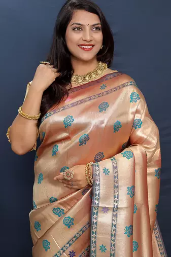 Rose gold silk blend saree with teal floral zari weaving & rich brocade pallu