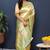 Beige gold silk blend saree with cyan floral zari weaving & rich brocade pallu