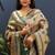 Gold silk blend saree with dark green floral zari weaving & rich brocade pallu