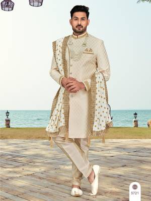 Cream colour havy sherwani set with less, thred & zari hand work 1