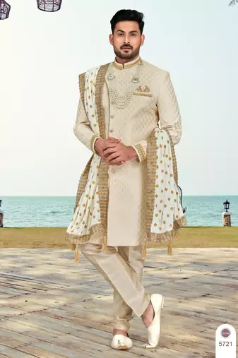 Cream colour havy sherwani set with less, thred & zari hand work