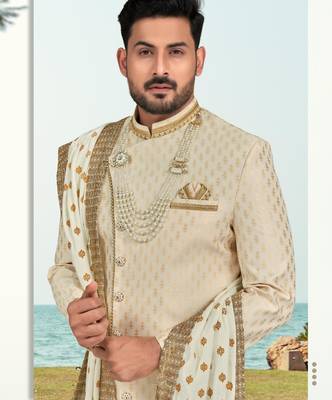 Cream colour havy sherwani set with less, thred & zari hand work 2
