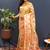 Beige gold silk blend saree with orange floral zari weaving & rich brocade pallu