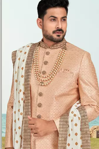 Peach colour full computer amrodery sherwani set with thred and stone work with handwork botton, collar