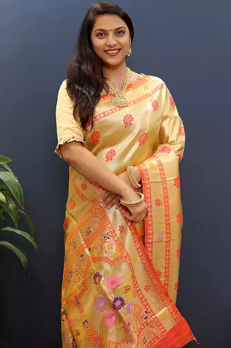 Beige gold silk blend saree with orange floral zari weaving & rich brocade pallu