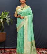 Sea green banarasi silk blend saree with zari buti & rich woven border