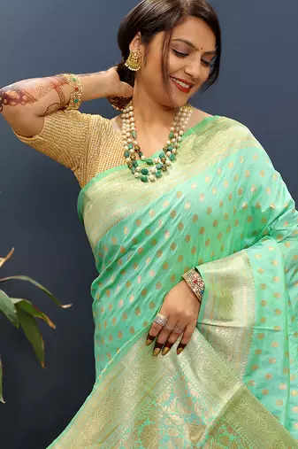 Sea green banarasi silk blend saree with zari buti & rich woven border