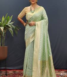 Mint green banarasi silk blend saree with zari buti & rich woven border