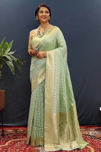 Mint green banarasi silk blend saree with zari buti & rich woven border