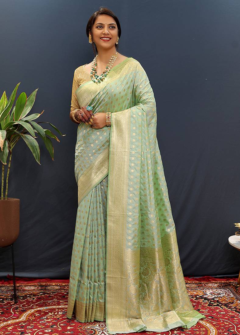 Mint green banarasi silk blend saree with zari buti & rich woven border