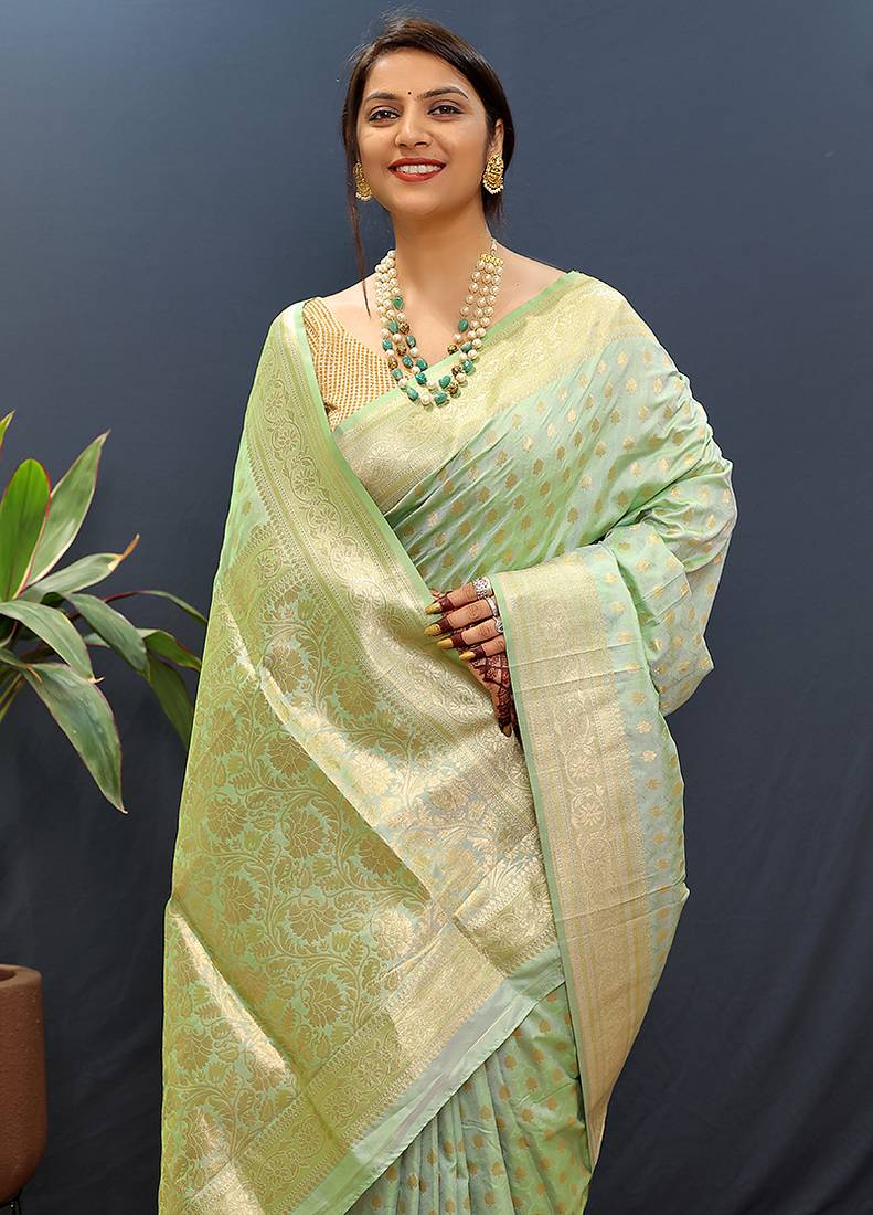 Mint green banarasi silk blend saree with zari buti & rich woven border