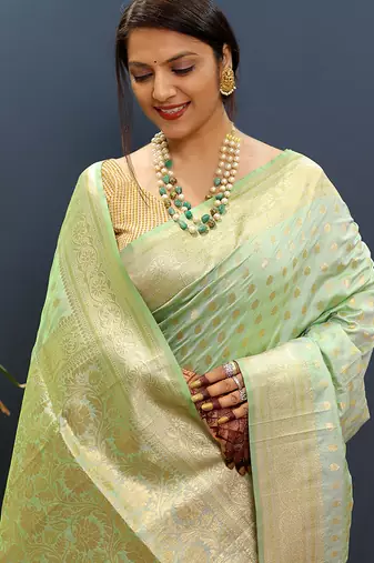 Mint green banarasi silk blend saree with zari buti & rich woven border