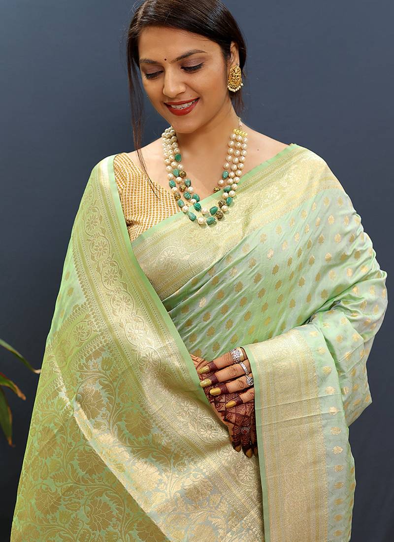 Mint green banarasi silk blend saree with zari buti & rich woven border