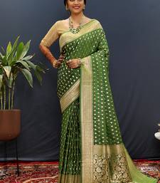 Dark green banarasi silk blend saree with zari buti & rich woven border