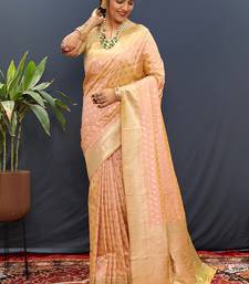 Peach banarasi silk blend saree with zari buti & rich woven border