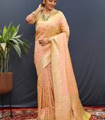 Peach banarasi silk blend saree with zari buti & rich woven border