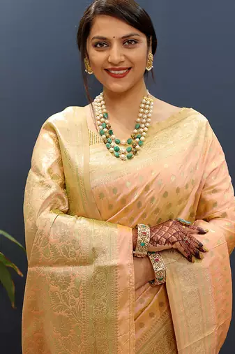 Peach banarasi silk blend saree with zari buti & rich woven border