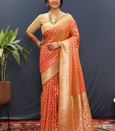 Orange banarasi silk blend saree with zari buti & rich woven border