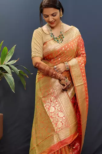 Orange banarasi silk blend saree with zari buti & rich woven border